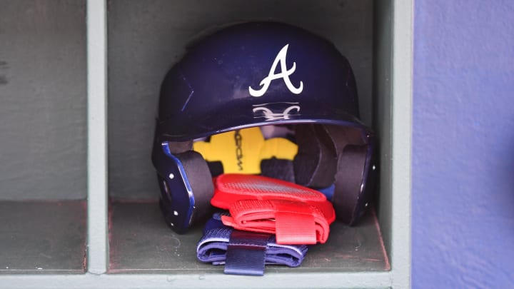 Mar 31, 2024; Philadelphia, Pennsylvania, USA; Atlanta Braves batting helmet inside the dugout before game against the Philadelphia Phillies at Citizens Bank Park. Mandatory Credit: Eric Hartline-USA TODAY Sports