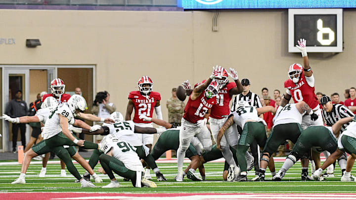 Oct 18, 2025; Bloomington, Indiana, USA; Indiana Hoosiers linebacker Kellan Wyatt (13) attempts to block a field goal during the second half against the Michigan State Spartans at Memorial Stadium. Mandatory Credit: Robert Goddin-Imagn Images