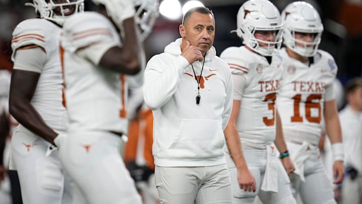Texas Longhorns head coach Steve Sarkisian leads warm ups prior to the Cotton Bowl Classic College Football Playoff semifinal game between the Ohio State Buckeyes and the Texas Longhorns at AT&T Stadium in Arlington, Texas on Jan. 10, 2025.