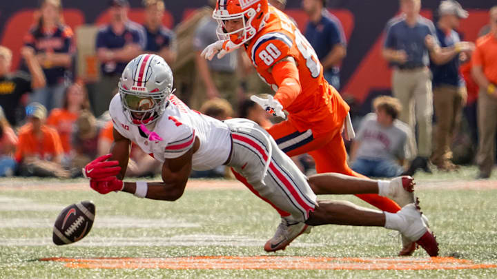 Ohio State Buckeyes cornerback Davison Igbinosun (1) dives for a pass intended for Illinois Fighting Illini wide receiver Hank Beatty (80) during the second half of the NCAA football game at Gies Memorial Stadium in Champaign on Oct. 11, 2025. Ohio State won 34-16. Ohio State Buckeyes cornerback Davison Igbinosun (1) dives for a pass intended for Illinois Fighting Illini wide receiver Hank Beatty (80) during the second half of the NCAA football game at Gies Memorial Stadium in Champaign on Oct. 11, 2025. Ohio State won 34-16.