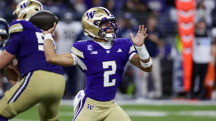 Sep 6, 2025; Seattle, Washington, USA; Washington Huskies quarterback Demond Williams Jr. (2) poses against the UC Davis Aggies during the third quarter at Husky Stadium. Mandatory Credit: Joe Nicholson-Imagn Images
