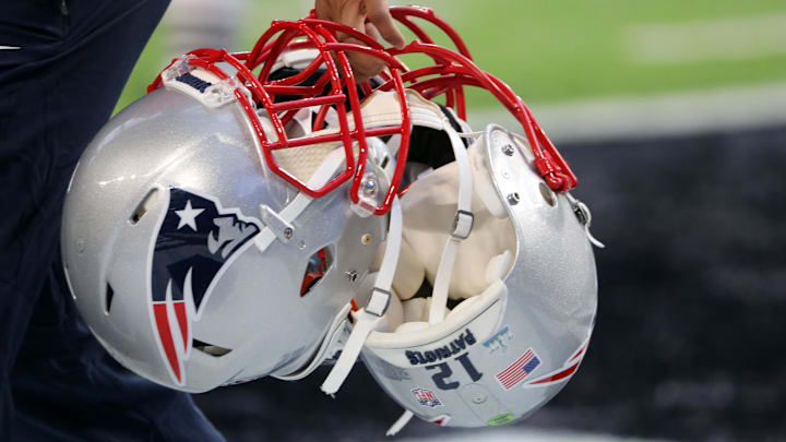 Feb 4, 2018; Minneapolis, MN, USA; The helmet of New England Patriots quarterback Tom Brady (not pictured) is taken onto the field prior to Super Bowl LII against the Philadelphia Eagles at U.S. Bank Stadium. Mandatory Credit: Winslow Townson-Imagn Images