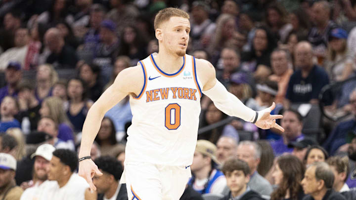March 16, 2024; Sacramento, California, USA; New York Knicks guard Donte DiVincenzo (0) celebrates a March 16, 2024; Sacramento, California, USA; New York Knicks guard Donte DiVincenzo (0) celebrates a