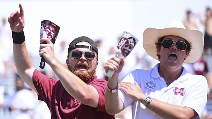 Mississippi State Bulldogs fans cheer during the third quarter against the Florida Gators at Davis Wade Stadium at Scott Field. Mississippi State Bulldogs fans cheer during the third quarter against the Florida Gators at Davis Wade Stadium at Scott Field.