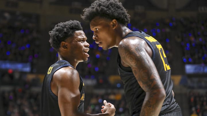 Feb 8, 2025; Morgantown, West Virginia, USA; West Virginia Mountaineers guard Joseph Yesufu (1) talks with West Virginia Mountaineers forward Amani Hansberry (13) during the first half against the Utah Utes at WVU Coliseum. Mandatory Credit: Ben Queen-Imagn Images