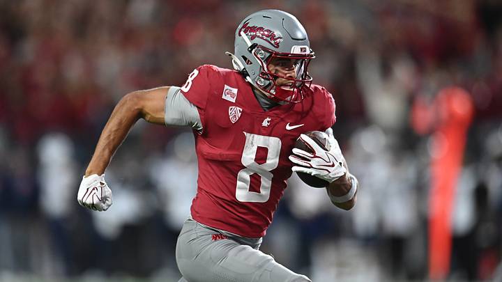 Washington State Cougars wide receiver Branden Ganashamoorthy (8) runs the ball in for a touchdown against the Arizona Wildcats during the second half at Gesa Field at Martin Stadium. Washington State Cougars wide receiver Branden Ganashamoorthy (8) runs the ball in for a touchdown against the Arizona Wildcats during the second half at Gesa Field at Martin Stadium.