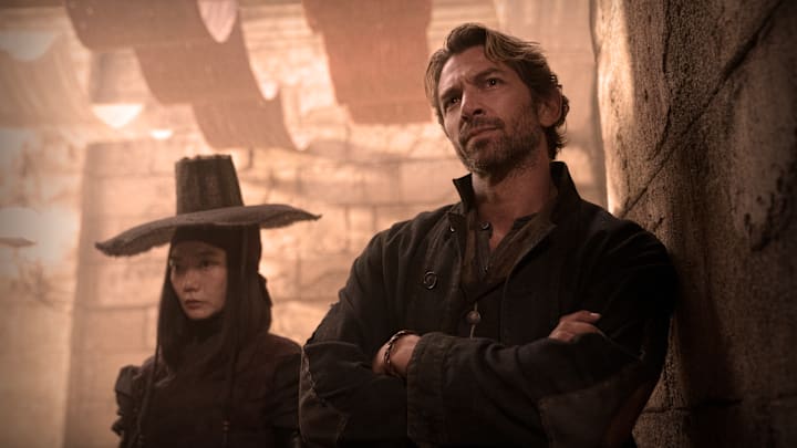 REBEL MOON: (L-R) Doona Bae as Nemesis and Michiel Huisman as Gunnar in Rebel Moon. Cr. Clay Enos/Netflix © 2023