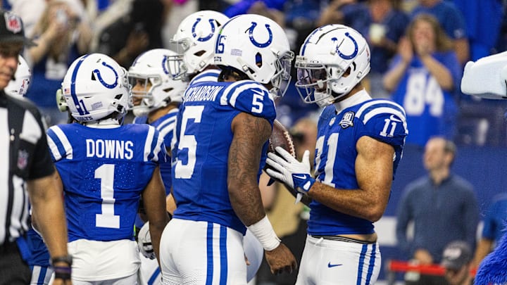 Sep 10, 2023; Indianapolis, Indiana, USA; Indianapolis Colts wide receiver Michael Pittman Jr. (11) gives his touchdown ball to quarterback Anthony Richardson (5) after scoring his first passing touchdown in the second half against the Jacksonville Jaguars at Lucas Oil Stadium. 