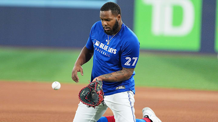 Aug 12, 2025; Toronto, Ontario, CAN; Toronto Blue Jays first baseman Vladimir Guerrero Jr. (27) fields balls during batting practice before a game against the Chicago Cubs at Rogers Centre Aug 12, 2025; Toronto, Ontario, CAN; Toronto Blue Jays first baseman Vladimir Guerrero Jr. (27) fields balls during batting practice before a game against the Chicago Cubs at Rogers Centre