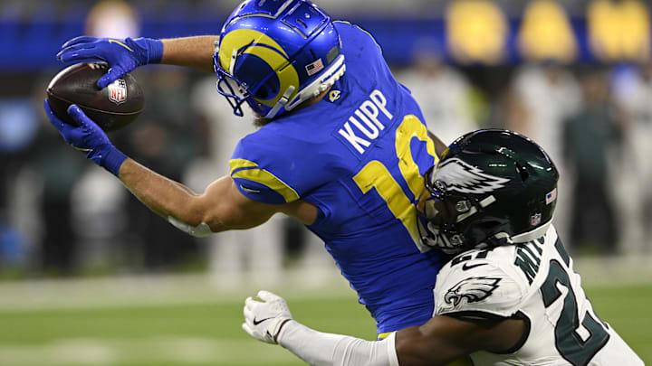 Nov 24, 2024; Inglewood, California, USA;  Los Angeles Rams wide receiver Cooper Kupp (10) catches a touchdown pass against Philadelphia Eagles cornerback Quinyon Mitchell (27) during the second half at SoFi Stadium. Mandatory Credit: Alex Gallardo-Imagn Images