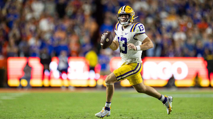 Nov 16, 2024; Gainesville, Florida, USA; LSU Tigers quarterback Garrett Nussmeier (13) runs with the ball against the Florida Gators during the second half at Ben Hill Griffin Stadium. Mandatory Credit: Matt Pendleton-Imagn Images