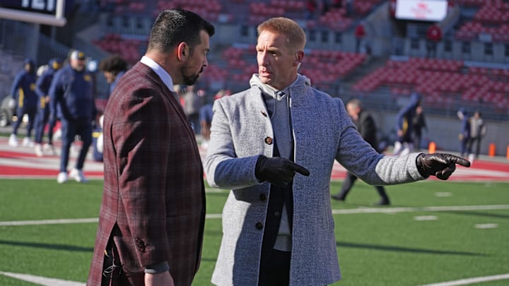 Ohio State University football coach Ryan Day talks with broadcaster Joel Klatt prior to the Michigan game Saturday, November 30, 2024 in Ohio Stadium.