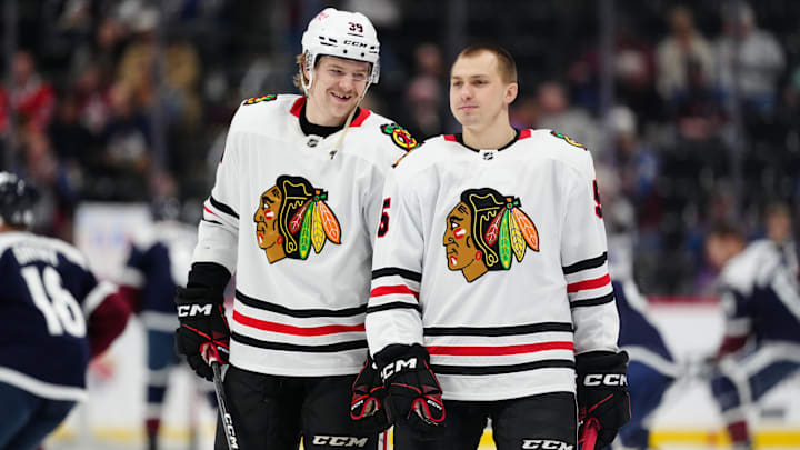 Mar 10, 2025; Denver, Colorado, USA; Chicago Blackhawks defenseman Ethan Del Mastro (38) and defenseman Artyom Levshunov (55) before the game against the Colorado Avalanche at Ball Arena. Mandatory Credit: Ron Chenoy-Imagn Images
