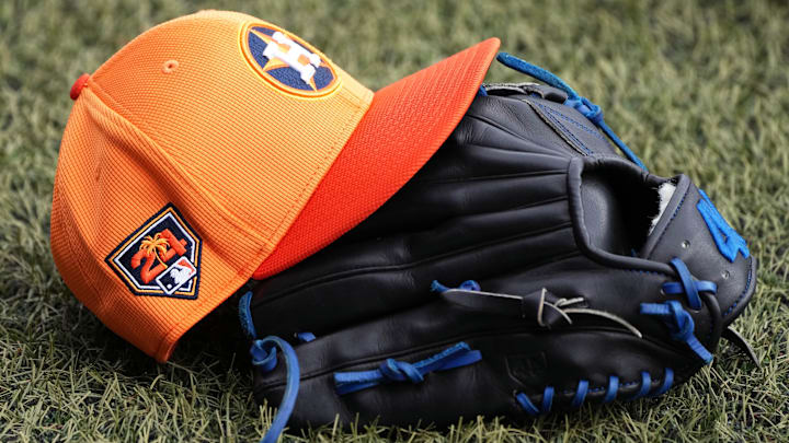 Houston Astros spring training cap and glove.