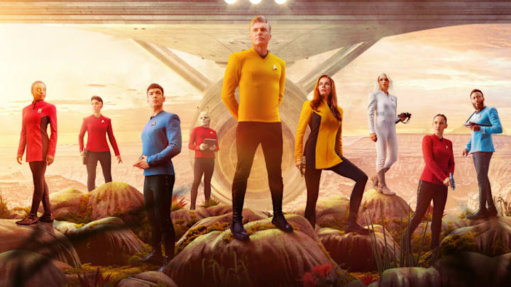 Pictured: (L-R) Celia Rose Gooding as Uhura, Melissa Navia as Ortegas, Ethan Peck as Spock, Bruce Horak as Hemmer, Anson Mount as Pike, Rebecca Romijn as Una, Jess Bush as Chapel, Christina Chong as La’an and Baby Olusanmokun as M’Benga in the official key art of the Paramount+ original series STAR TREK: STRANGE NEW WORLDS. Photo Cr: James Dimmock/Paramount+ ©2022 ViacomCBS. All Rights Reserved.