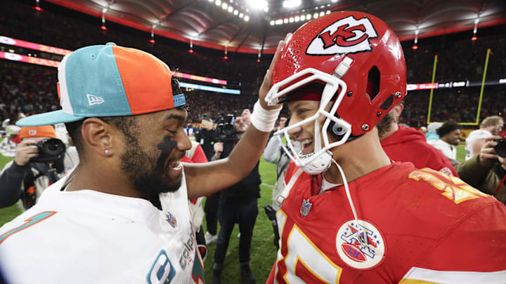 Kansas City Chiefs quarterback Patrick Mahomes (15) greets Miami Dolphins quarterback Tua Tagovailoa (1) after an NFL International Series game at Deutsche Bank Park in 2023.
