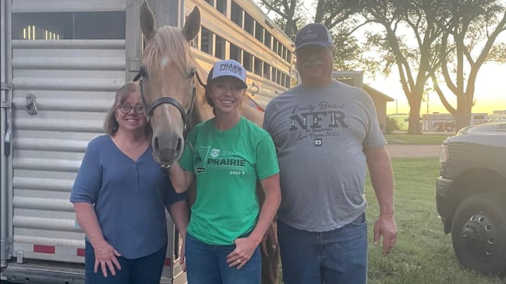 Emily with parents and Chewy