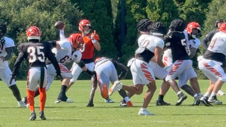 Bengals rookie stumbles before going into quarterback Joe Burrow's legs. Bengals rookie stumbles before going into quarterback Joe Burrow's legs.