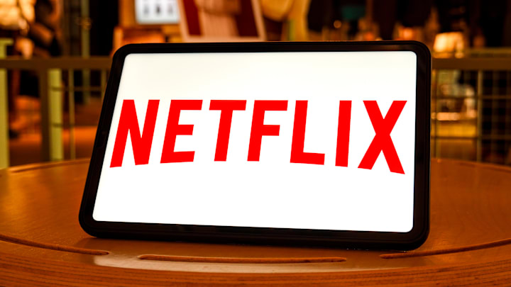 In this photo illustration, a Netflix logo is  seen