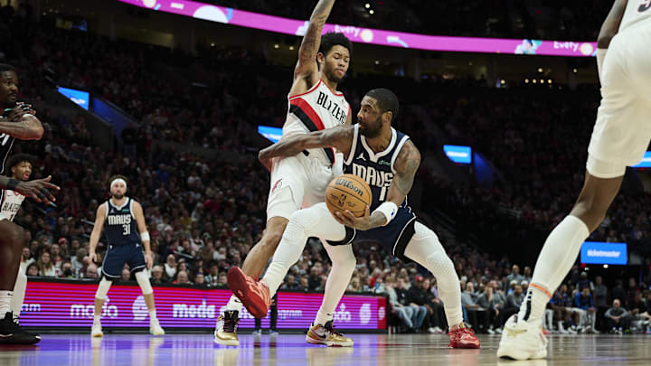 Dec 28, 2024; Portland, Oregon, USA; Dallas Mavericks guard Kyrie Irving (11) drives to the basket during the second half against Portland Trail Blazers guard Anfernee Simons (1) at Moda Center. Mandatory Credit: Troy Wayrynen-Imagn Images Dec 28, 2024; Portland, Oregon, USA; Dallas Mavericks guard Kyrie Irving (11) drives to the basket during the second half against Portland Trail Blazers guard Anfernee Simons (1) at Moda Center. Mandatory Credit: Troy Wayrynen-Imagn Images