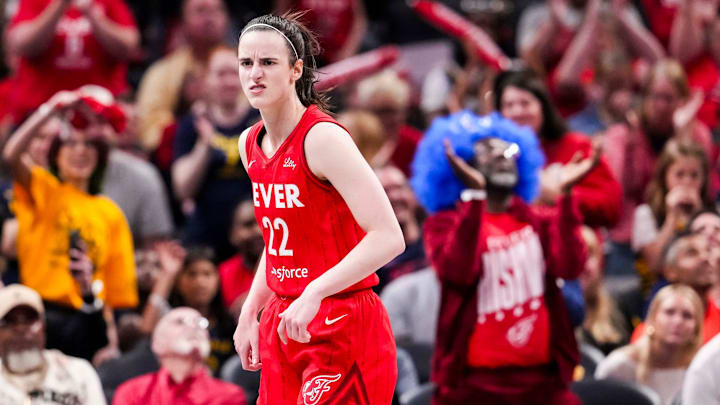 Indiana Fever guard Caitlin Clark reacts to scoring a 3-pointer Saturday, May 17, 2025, during a game against the Chicago Sky at Gainbridge Fieldhouse in Indianapolis.