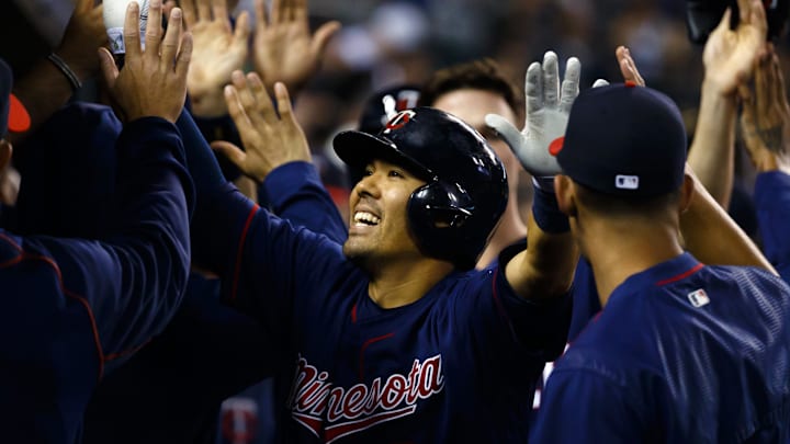 Sep 14, 2016; Detroit, MI, USA; Minnesota Twins catcher Kurt Suzuki (8) receives congratulations from teammates after he hits a three run home run in the fourth inning against the Detroit Tigers at Comerica Park. Mandatory Credit: Rick Osentoski-Imagn Images