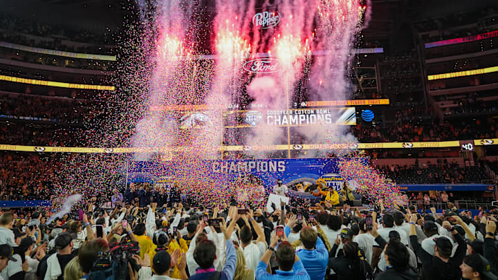 Dec 29, 2023; Arlington, Texas, USA; The Missouri Tigers hoist the Field Scovell Trophy following their 14-3 win over the Ohio State Buckeyes in the Goodyear Cotton Bowl Classic at AT&T Stadium.