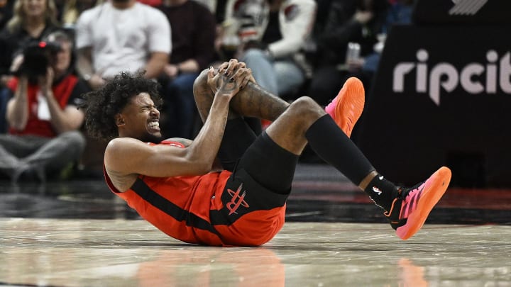 Apr 12, 2024; Portland, Oregon, USA; Houston Rockets guard Jalen Green (4) grabs his knee in pain Apr 12, 2024; Portland, Oregon, USA; Houston Rockets guard Jalen Green (4) grabs his knee in pain