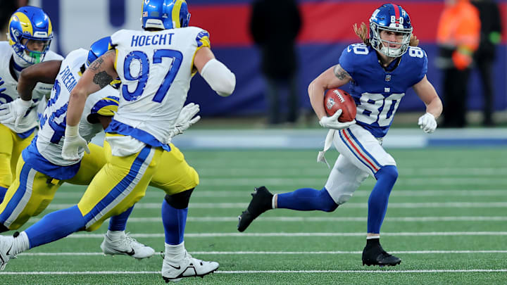 Dec 31, 2023; East Rutherford, New Jersey, USA; New York Giants wide receiver Gunner Olszewski (80) returns a punt against Los Angeles Rams linebacker Michael Hoecht (97) and running back Royce Freeman (24) during the fourth quarter at MetLife Stadium. Dec 31, 2023; East Rutherford, New Jersey, USA; New York Giants wide receiver Gunner Olszewski (80) returns a punt against Los Angeles Rams linebacker Michael Hoecht (97) and running back Royce Freeman (24) during the fourth quarter at MetLife Stadium.