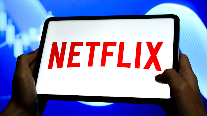 In this photo illustration, a Netflix logo is seen displayed...