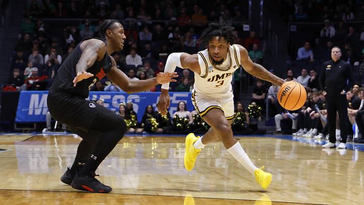 Mar 17, 2026; Dayton, OH, USA; UMBC Retrievers forward DJ Armstrong (3) dribbles the ball defended by Howard Bison forward Calvin Robins Jr. (21) in the first half during a first four game of the men's 2026 NCAA Tournament at University of Dayton Arena. Mandatory Credit: Rick Osentoski-Imagn Images Mar 17, 2026; Dayton, OH, USA; UMBC Retrievers forward DJ Armstrong (3) dribbles the ball defended by Howard Bison forward Calvin Robins Jr. (21) in the first half during a first four game of the men's 2026 NCAA Tournament at University of Dayton Arena. Mandatory Credit: Rick Osentoski-Imagn Images