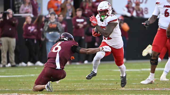 Nov 1, 2025; Blacksburg, Va.; Virginia Tech safety Jordan Bass (6) attempts to tackle Louisville running back Keyjuan Brown (22). Nov 1, 2025; Blacksburg, Va.; Virginia Tech safety Jordan Bass (6) attempts to tackle Louisville running back Keyjuan Brown (22).