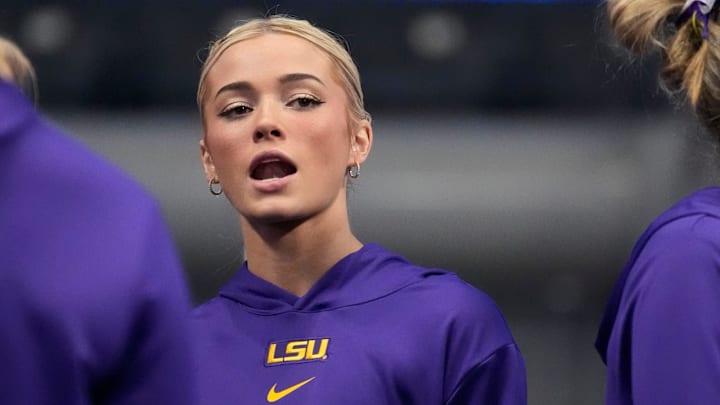LSU gymnast Livvy Dunne stretches with teammates before Session 2 of the SEC Gymnastics Tournament at Legacy Arena in Birmingham, Alabama.