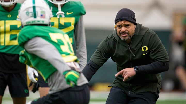 Oregon cornerbacks coach Demetrice Martin works with players April 14, 2022, during practice in Eugene, Ore.