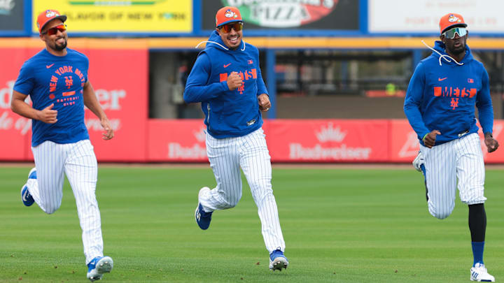 Feb 17, 2026; Port St. Lucie, FL, USA; New York Mets infielder Marcus Semien (left), infielder Mark Vientos (center) and infielder Ronny Mauricio (right) run on the field during spring training at Clover Park. Mandatory Credit: Sam Navarro-Imagn Images