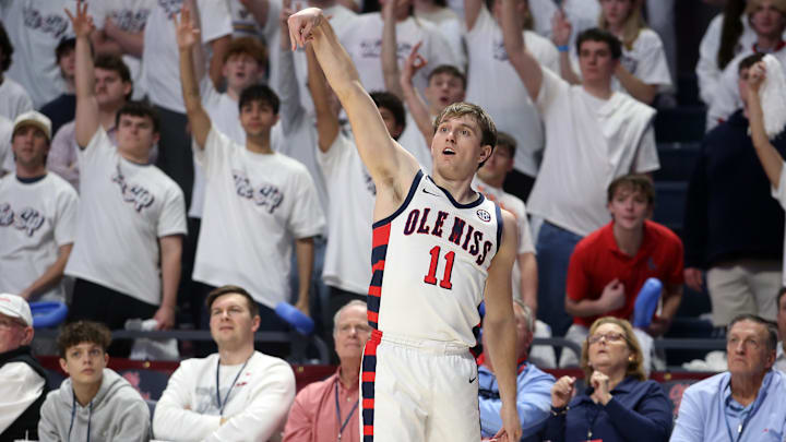 Feb 11, 2026; Oxford, Mississippi, USA; Mississippi Rebels guard Travis Perry (11) holds after shooting for three during the first half against the Alabama Crimson Tide at The Sandy and John Black Pavilion at Ole Miss. Mandatory Credit: Petre Thomas-Imagn Images Feb 11, 2026; Oxford, Mississippi, USA; Mississippi Rebels guard Travis Perry (11) holds after shooting for three during the first half against the Alabama Crimson Tide at The Sandy and John Black Pavilion at Ole Miss. Mandatory Credit: Petre Thomas-Imagn Images