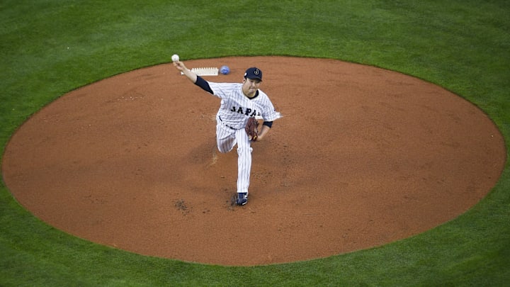 Los Angeles, CA, USA; Japan starting pitcher Tomoyuki Sugano (11) pitches against the United States during the first inning of the 2017 World Baseball Classic at Dodger Stadium. Los Angeles, CA, USA; Japan starting pitcher Tomoyuki Sugano (11) pitches against the United States during the first inning of the 2017 World Baseball Classic at Dodger Stadium.