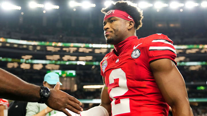 Ohio State Buckeyes defensive back Caleb Downs (2) leaves the field following the Cotton Bowl at AT&T Stadium in Arlington, Texas for the College Football Playoff quarterfinal game against the Miami Hurricanes on Dec. 31, 2025. Ohio State lost 24-14.