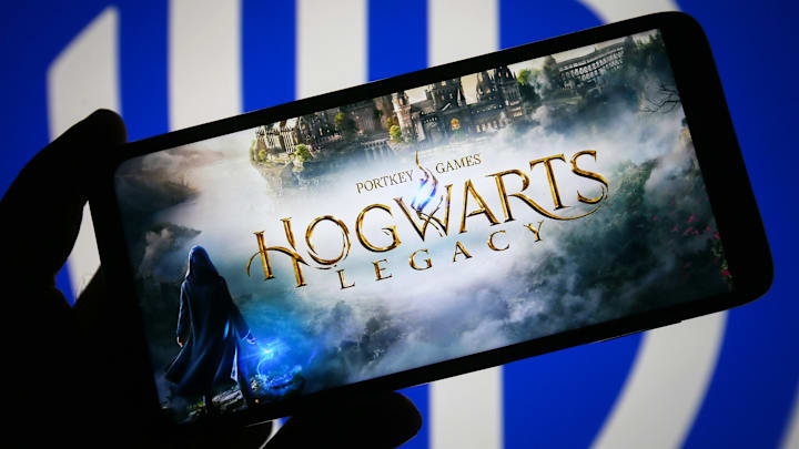 In this photo illustration, Hogwarts Legacy logo of a video...