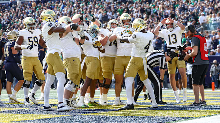 Oct 26, 2024; East Rutherford, New Jersey, USA;  Notre Dame Fighting Irish running back Jeremiyah Love (4) celebrates a rushing a touchdown with teammates during the first half against the Notre Dame Fighting Irish at MetLife Stadium. Mandatory Credit: Vincent Carchietta-Imagn Images