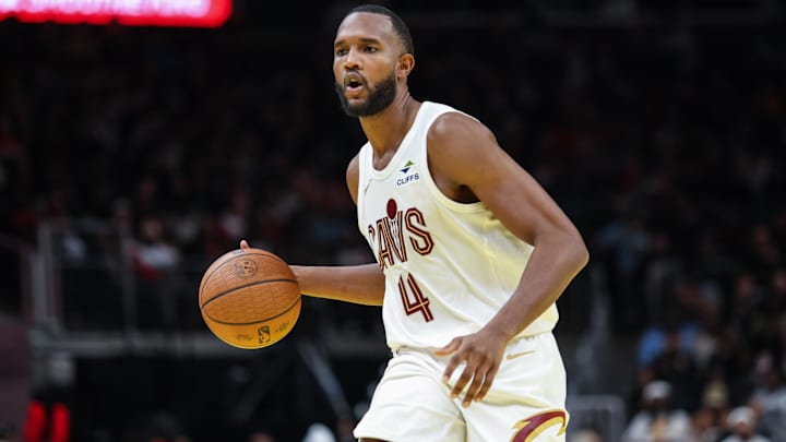 Nov 29, 2024; Atlanta, Georgia, USA; Cleveland Cavaliers forward Evan Mobley (4) dribbles the ball in the game against the Cleveland Cavaliers during the fourth quarter at State Farm Arena. Mandatory Credit: Jordan Godfree-Imagn Images