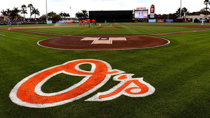 View of the Baltimore Orioles logo on the field before the start of the spring training game against the Tampa Bay Rays at Ed Smith Stadium View of the Baltimore Orioles logo on the field before the start of the spring training game against the Tampa Bay Rays at Ed Smith Stadium