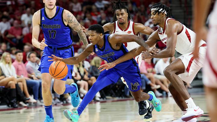 Oct 28, 2026; Fayetteville, Arkansas, USA; Memphis Tigers guard Jayden Reid (0) drives between Arkansas Razorbacks defenders during the first half at Bud Walton Arena. Mandatory Credit: Nelson Chenault-Imagn Images Oct 28, 2026; Fayetteville, Arkansas, USA; Memphis Tigers guard Jayden Reid (0) drives between Arkansas Razorbacks defenders during the first half at Bud Walton Arena. Mandatory Credit: Nelson Chenault-Imagn Images