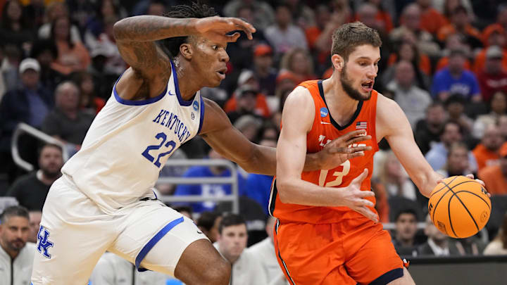 Mar 23, 2025; Milwaukee, WI, USA;  Illinois Fighting Illini center Tomislav Ivisic (13) controls the ball against Kentucky Wildcats center Amari Williams (22) during the second half in the second round of the NCAA Tournament at Fiserv Forum. Mandatory Credit: Jeff Hanisch-Imagn Images