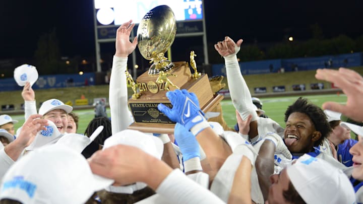 McCallie players rush towards the TSSAA DII-AAA Football Championship trophy as they defeat rivals Baylor 27-21 inside Finley Stadium, Chattanooga, Tenn., on Thursday, Dec. 5, 2024. McCallie players rush towards the TSSAA DII-AAA Football Championship trophy as they defeat rivals Baylor 27-21 inside Finley Stadium, Chattanooga, Tenn., on Thursday, Dec. 5, 2024.