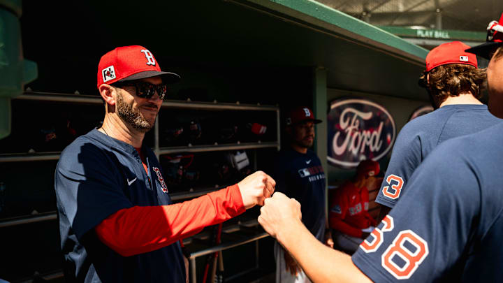 WooSox manager Chad Tracy fist bumps a player during a Boston Red Sox spring training game in Fort Myers, Florida, on March 11, 2025.