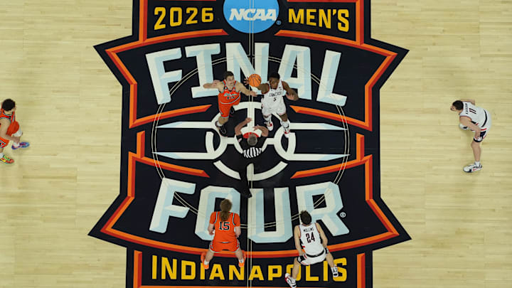 Apr 4, 2026; Indianapolis, IN, USA; Illinois Fighting Illini center Tomislav Ivisic (13) and UConn Huskies forward Tarris Reed Jr. (5) jump for the tipoff during a semifinal of the Final Four of the men's 2026 NCAA Tournament at Lucas Oil Stadium. Mandatory Credit: James Lang-Imagn Images Apr 4, 2026; Indianapolis, IN, USA; Illinois Fighting Illini center Tomislav Ivisic (13) and UConn Huskies forward Tarris Reed Jr. (5) jump for the tipoff during a semifinal of the Final Four of the men's 2026 NCAA Tournament at Lucas Oil Stadium. Mandatory Credit: James Lang-Imagn Images