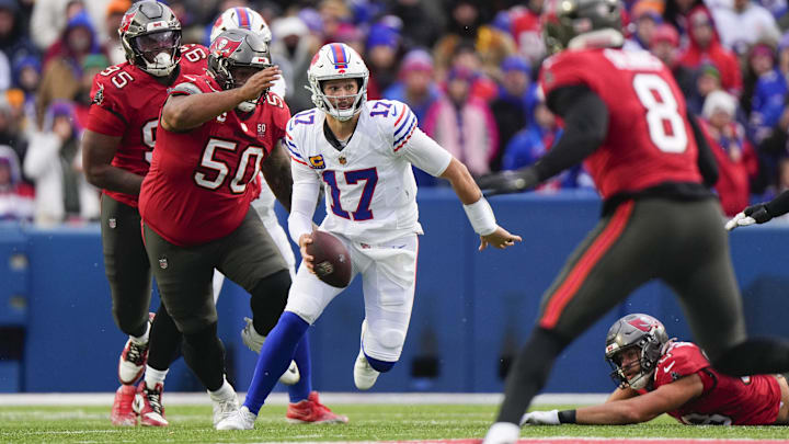 Nov 16, 2025; Orchard Park, New York, USA;  Buffalo Bills quarterback Josh Allen (17) scrambles against Tampa Bay Buccaneers defensive tackle Vita Vea (50)