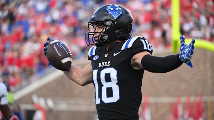 Sep 20, 2025; Durham, North Carolina, USA; Duke Blue Devils wide receiver Cooper Barkate (18) celebrates a touchdown during the third quarter against the NC State Wolfpack at Wallace Wade Stadium. Mandatory Credit: Zachary Taft-Imagn Images Sep 20, 2025; Durham, North Carolina, USA; Duke Blue Devils wide receiver Cooper Barkate (18) celebrates a touchdown during the third quarter against the NC State Wolfpack at Wallace Wade Stadium. Mandatory Credit: Zachary Taft-Imagn Images