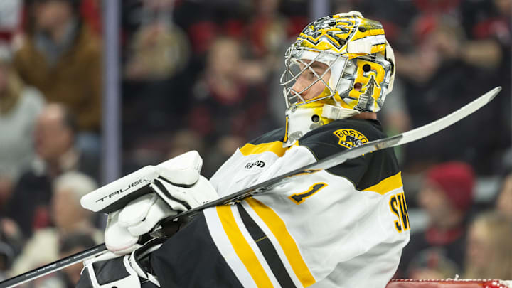 Boston Bruins goalie Jeremy Swayman stretches during a break in action in the first period against the Ottawa Senators.